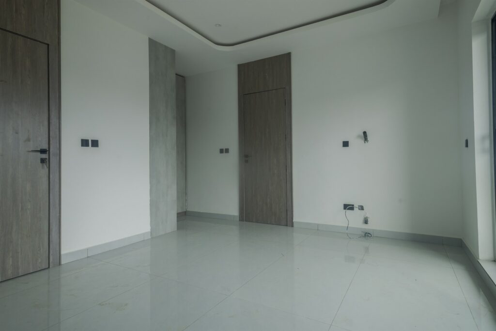 Brum Height 8: Bedroom with built-in wardrobes and polished flooring